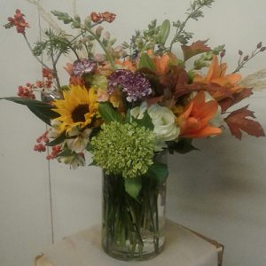 Array Of Flowers Gathered In A Clear Glass Vase